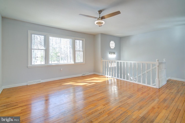 spare room with ceiling fan and light hardwood / wood-style floors