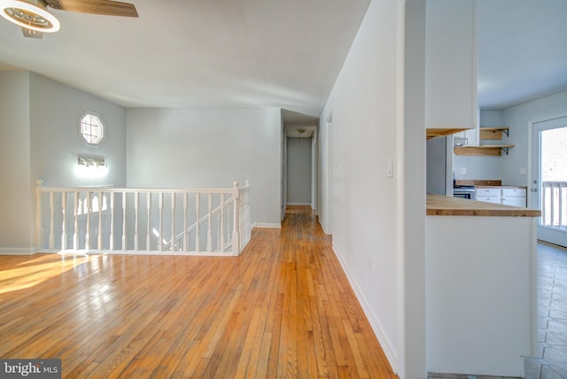 hall with light hardwood / wood-style flooring