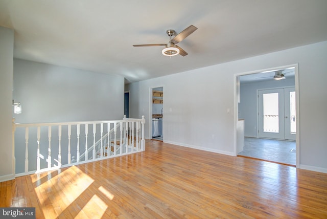 empty room featuring ceiling fan and light wood-type flooring