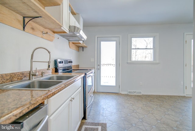 kitchen with stainless steel appliances, sink, and white cabinets