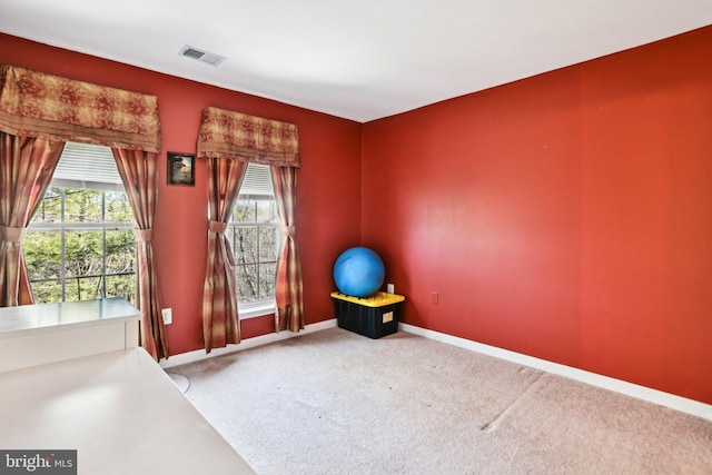 interior space featuring light colored carpet