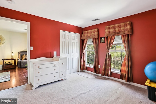 bedroom with a closet and carpet