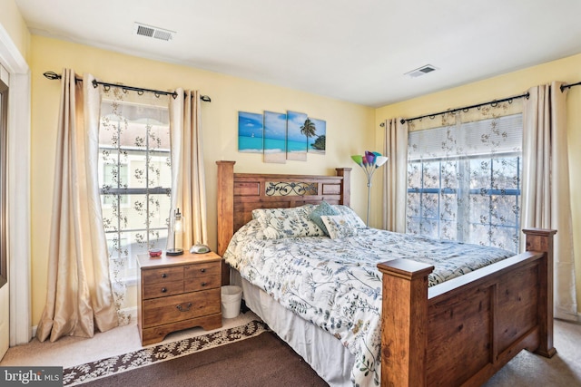 bedroom with light colored carpet