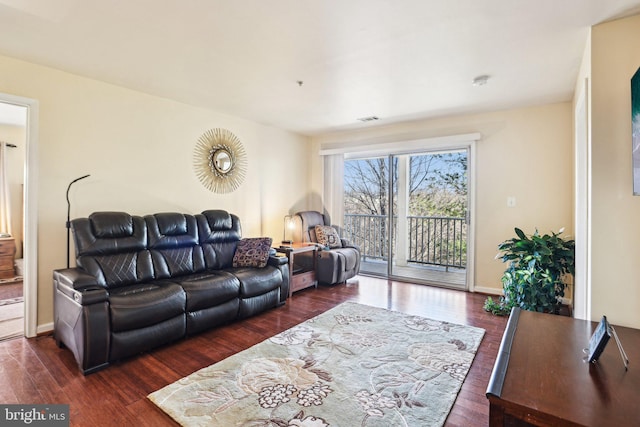 living room with dark hardwood / wood-style flooring