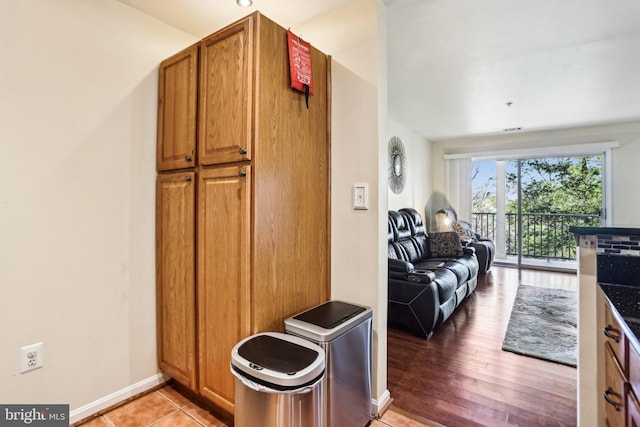 kitchen with hardwood / wood-style floors