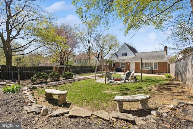 view of yard featuring a fenced backyard and a patio area