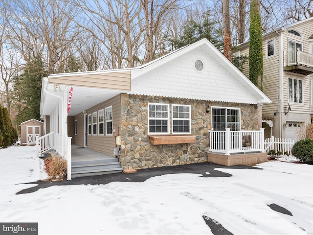 view of front of house with a shed