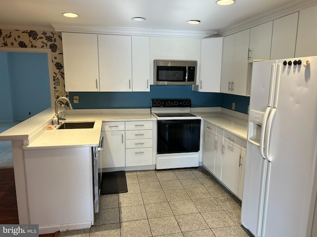 kitchen with sink, white cabinetry, range with electric stovetop, white fridge with ice dispenser, and kitchen peninsula