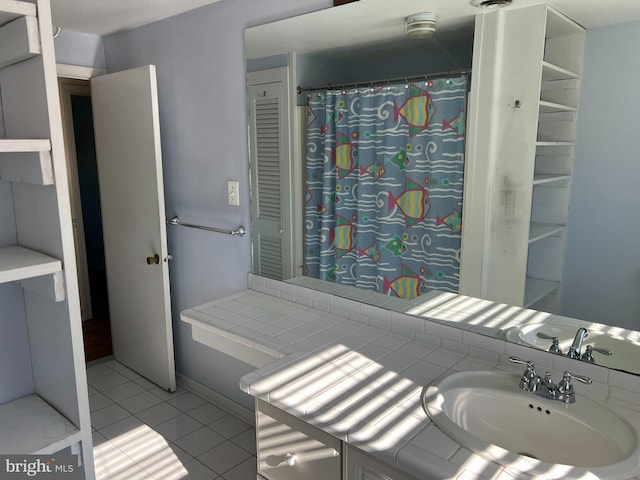 bathroom with tile patterned flooring and sink