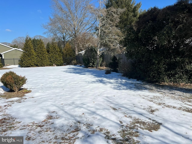 view of yard layered in snow