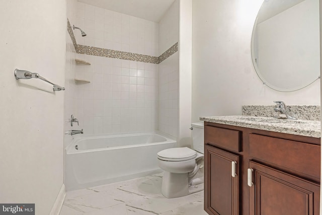 full bathroom featuring vanity, tiled shower / bath, and toilet