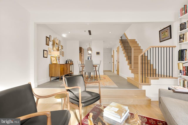 living room with light hardwood / wood-style flooring