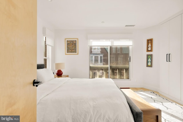 bedroom featuring wood-type flooring