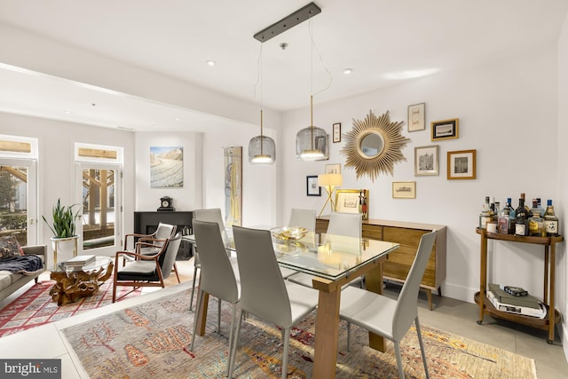 dining area featuring light tile patterned flooring