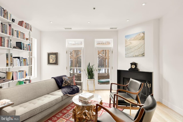 sitting room with light hardwood / wood-style flooring