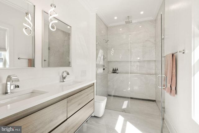 bathroom featuring toilet, a shower with door, crown molding, and vanity