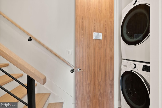 clothes washing area with stacked washer / drying machine