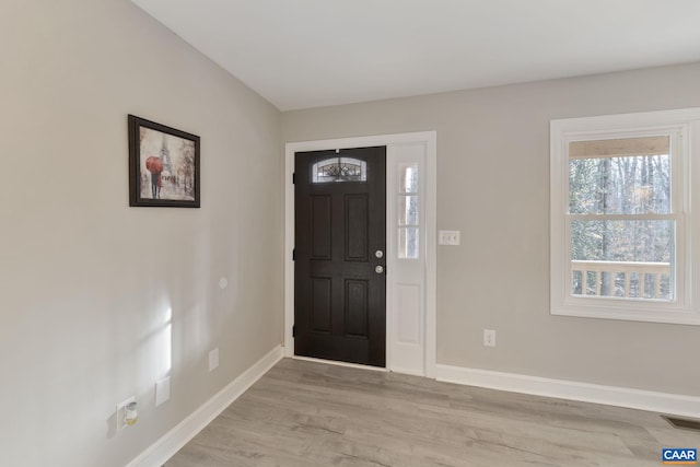 entryway with light hardwood / wood-style flooring