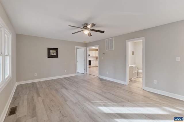 unfurnished room featuring light wood-type flooring and ceiling fan