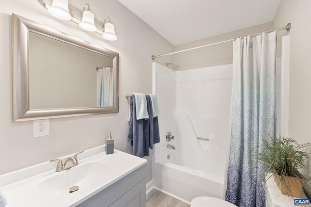 full bathroom featuring wood-type flooring, toilet, shower / tub combo, and vanity