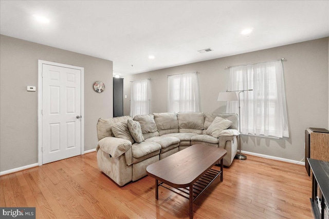 living room with light hardwood / wood-style floors