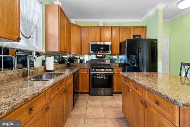 kitchen featuring light tile patterned flooring, sink, ornamental molding, black appliances, and light stone countertops