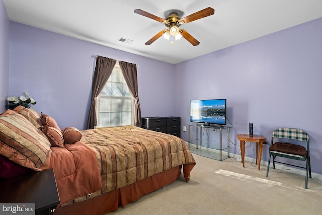 bedroom with light carpet and ceiling fan