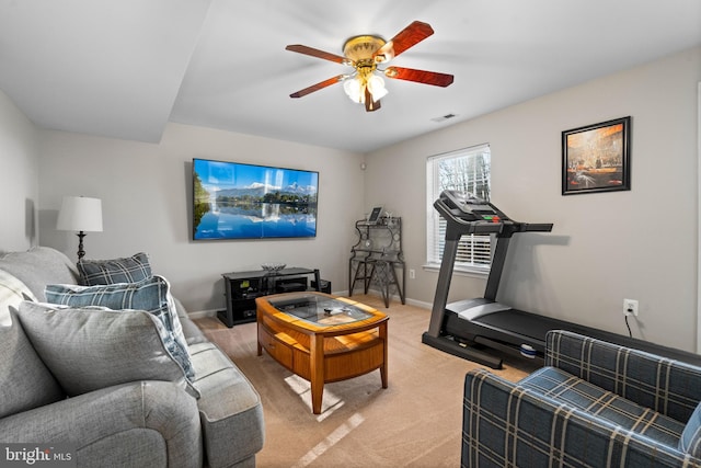 living room featuring light colored carpet and ceiling fan