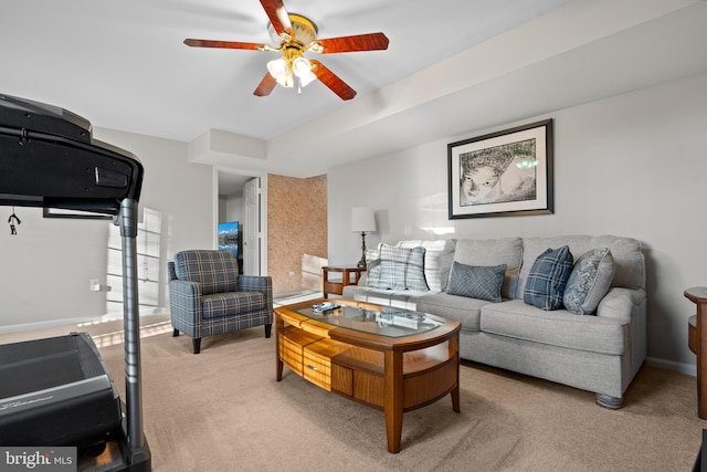 living room with ceiling fan and light colored carpet