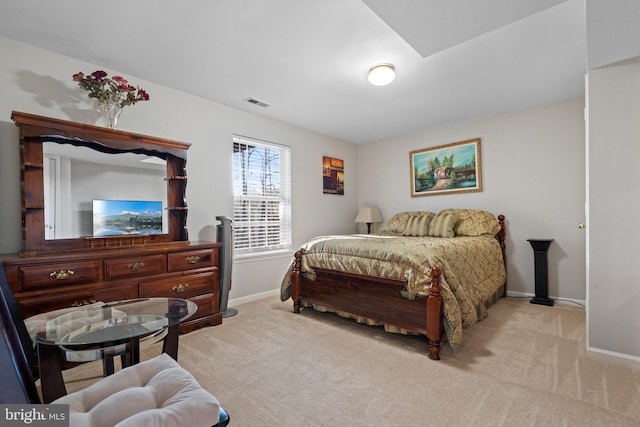 bedroom with light colored carpet