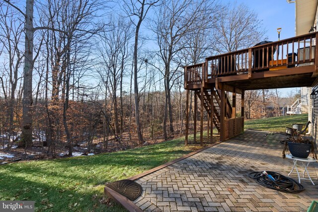 view of yard with a patio area and a deck