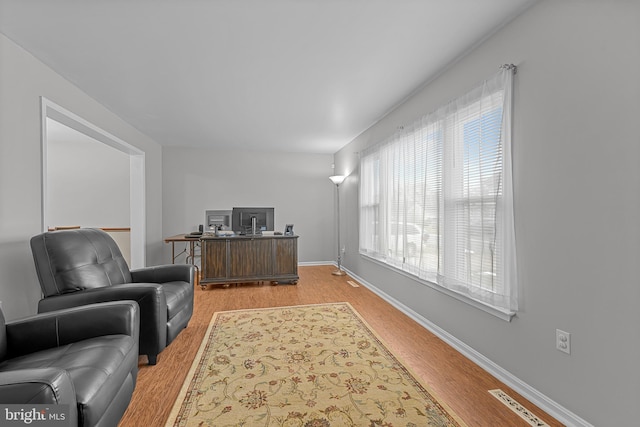 office area with light hardwood / wood-style floors