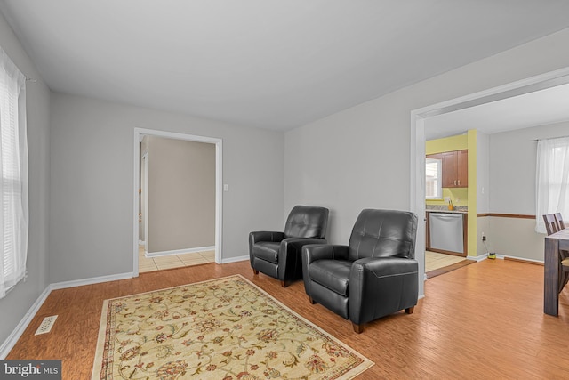 sitting room featuring light hardwood / wood-style floors