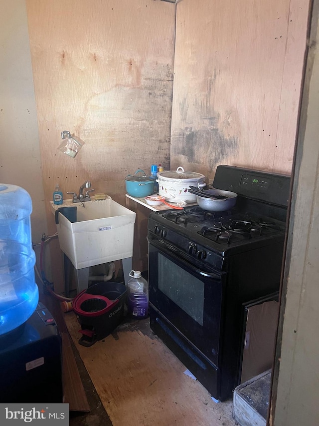 kitchen featuring black range with gas stovetop and sink