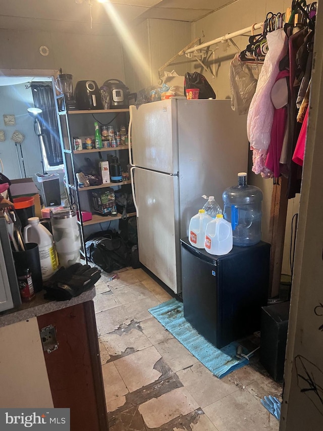 kitchen with fridge and white fridge