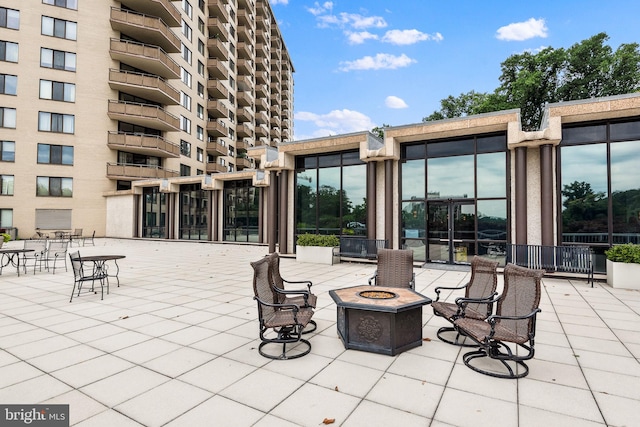 view of patio featuring a fire pit