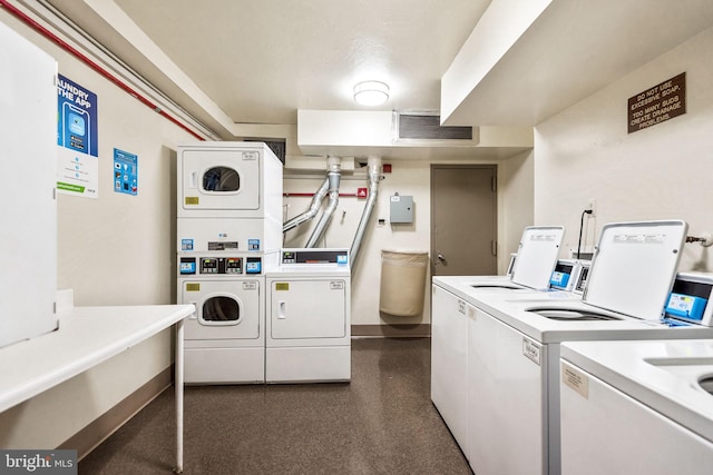 washroom featuring washing machine and clothes dryer and stacked washer / drying machine