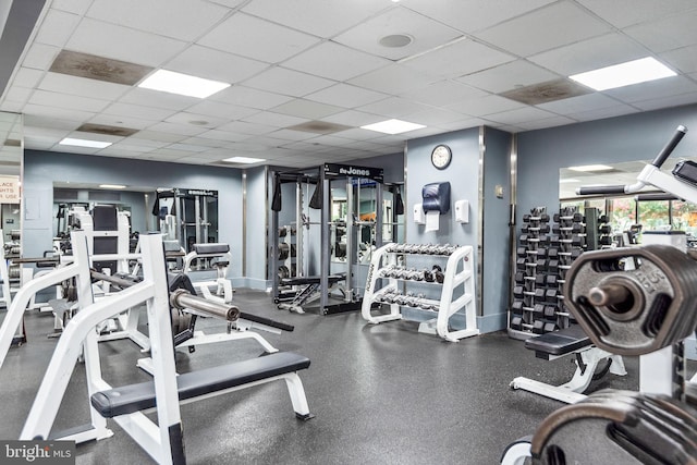 exercise room featuring a drop ceiling