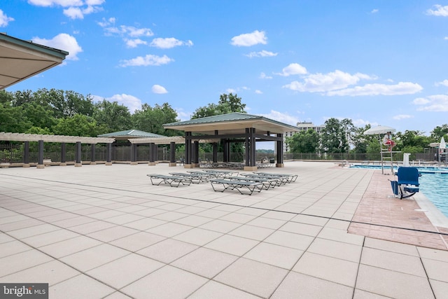 view of patio / terrace featuring a gazebo and a community pool