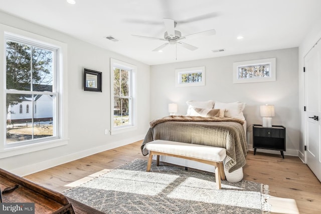 bedroom with ceiling fan and light wood-type flooring