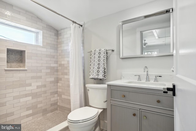 bathroom with walk in shower, vanity, toilet, and vaulted ceiling