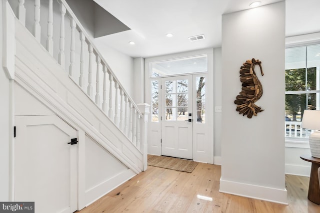 foyer with light hardwood / wood-style floors