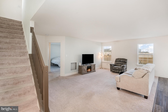 carpeted living room featuring a wealth of natural light