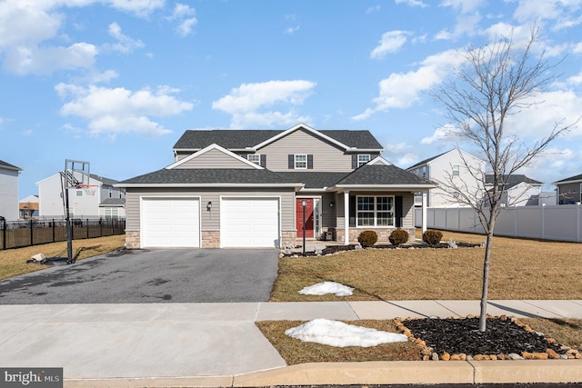 front facade with a porch, a garage, and a front yard