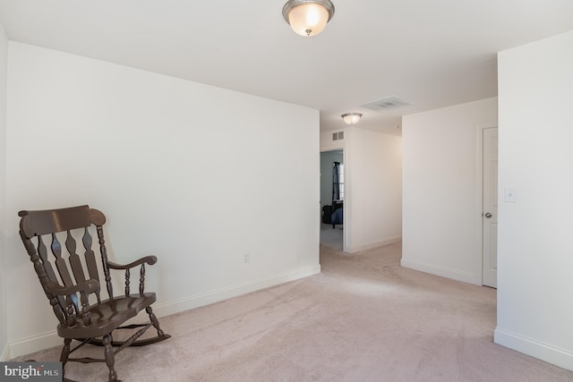 unfurnished room featuring light colored carpet