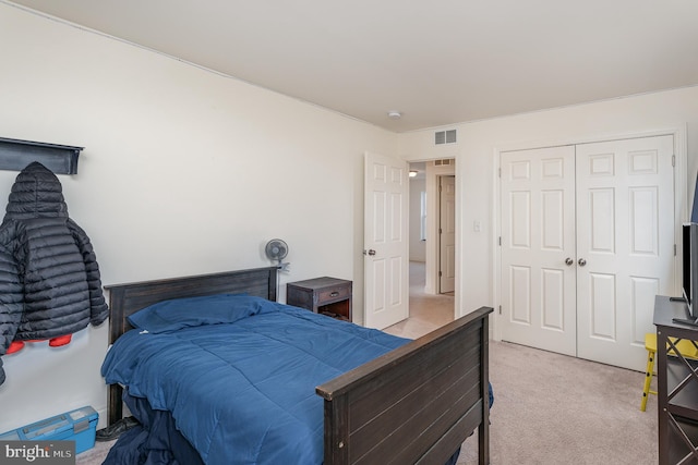 carpeted bedroom featuring a closet