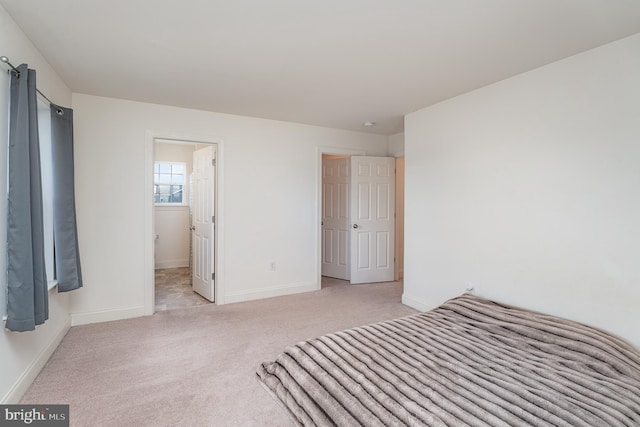 unfurnished bedroom with light carpet