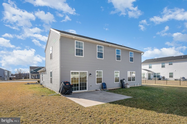 rear view of property with a patio area and a lawn