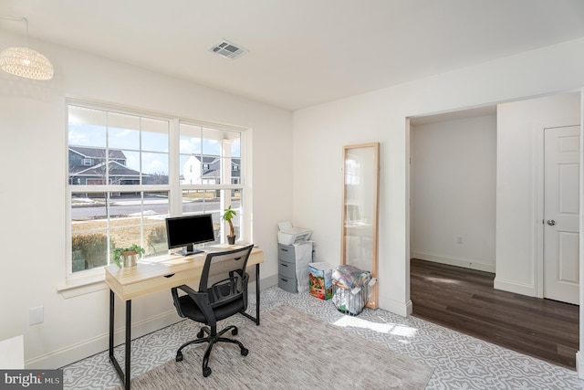 office space with hardwood / wood-style floors