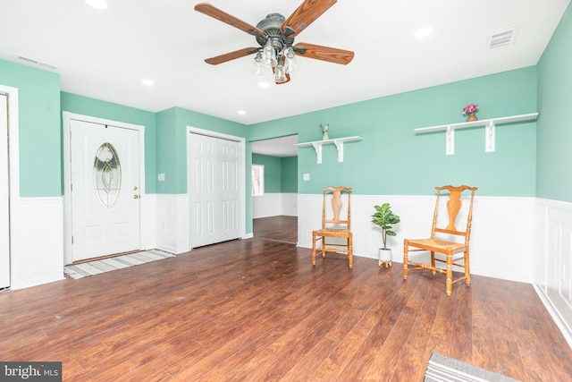 unfurnished room featuring dark wood-type flooring and ceiling fan